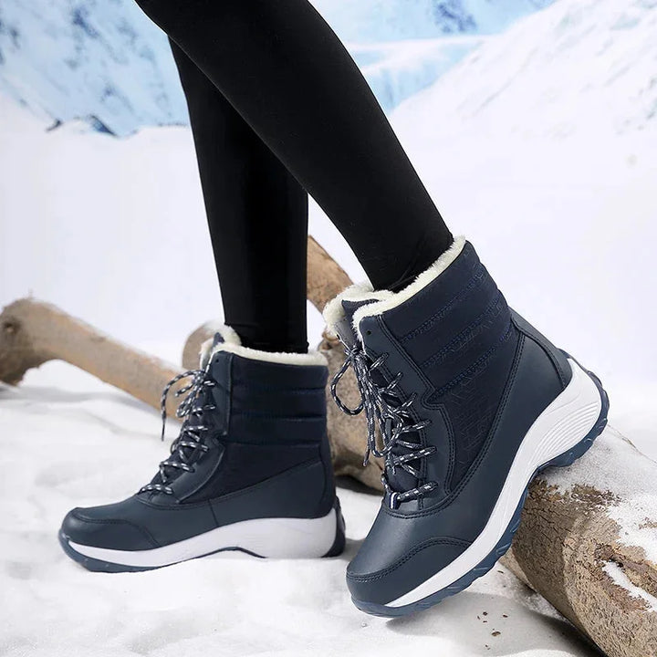 Women's waterproof snow boots with faux fur trim lace up ankle style