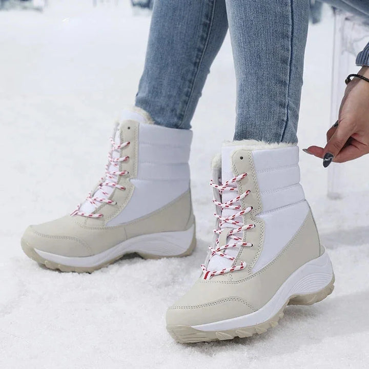 Women's waterproof snow boots with faux fur trim lace up ankle style